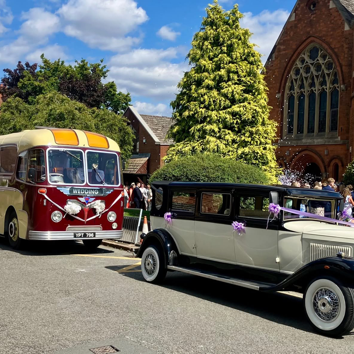 Vintage wedding car and classic bus outside St Mary’s Church in Harborne, Birmingham