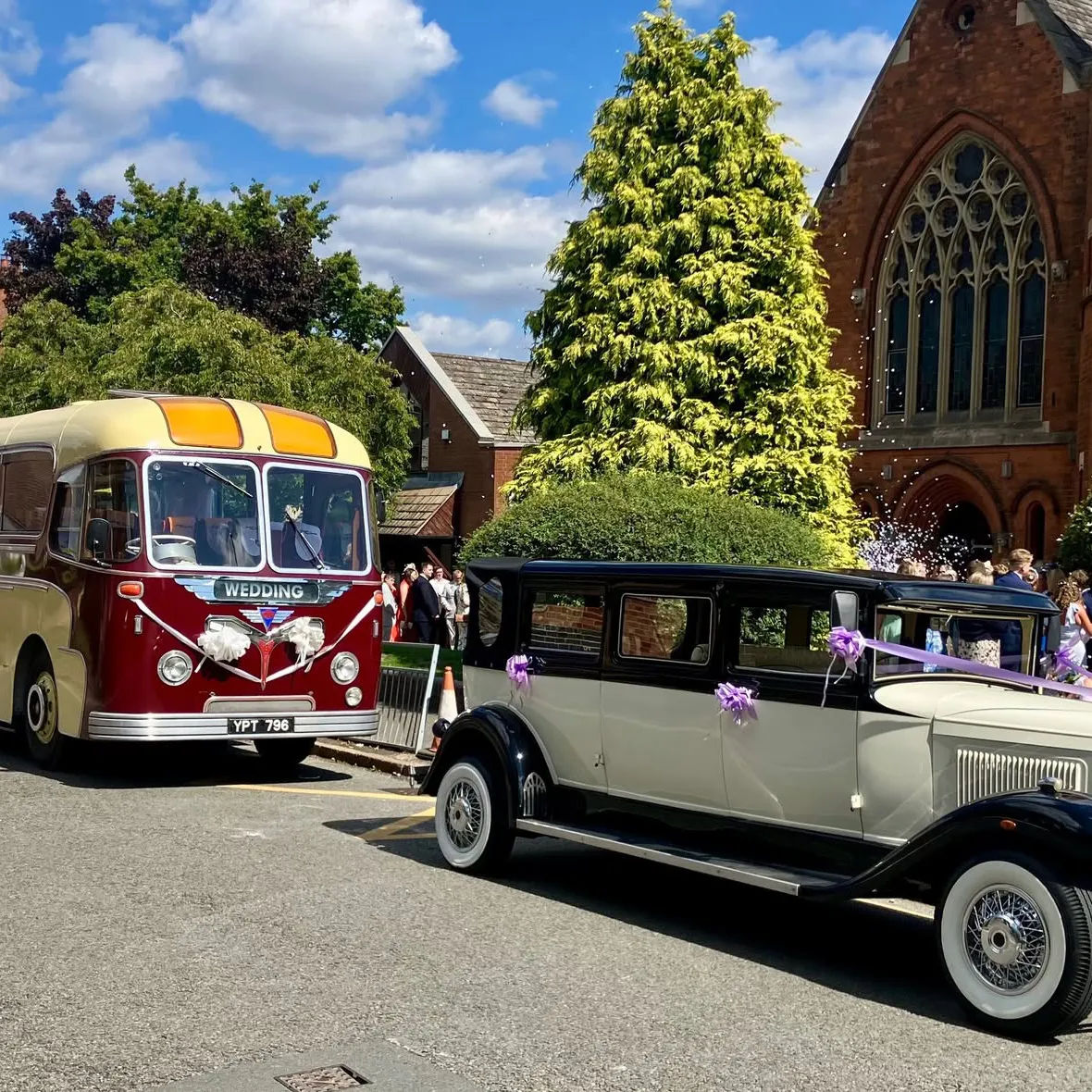 Vintage wedding car and classic bus outside St Mary’s Church in Harborne, Birmingham