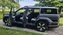 Hyundai Santa Fe Ultimate HEV with passenger doors open showing spacious seven seat interior.