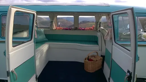 Blue and white rear L-shape seating inside 1967 Volkswagen Split Screen campervan