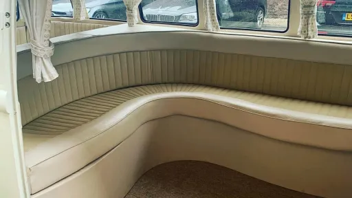 Cream L shaped rear seating inside 1972 Volkswagen Split Screen campervan.