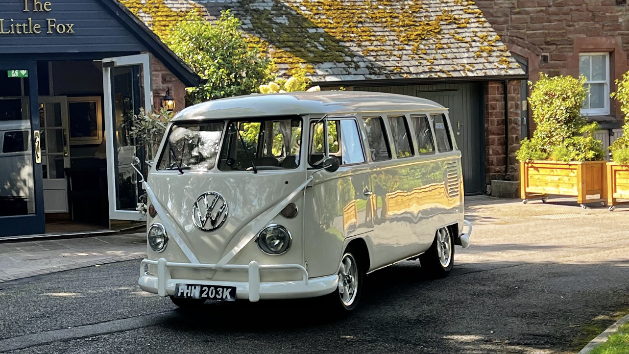 Cream 1972 Volkswagen Split Screen campervan parked outside The Little Fox wedding venue in Liverpool.
