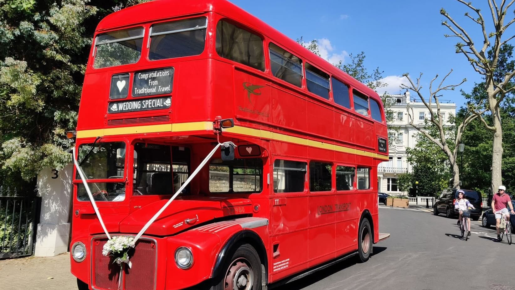 Red double decker bus in street of London