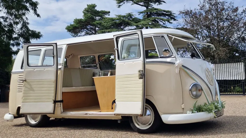 Cream and beige 1964 VW Split Screen Campervan with passenger doors open showing the classic interior.