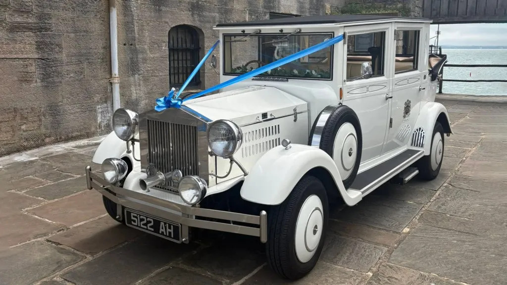 White Imperial Viscount Landaulette 7-passenger wedding car with Blue Ribbons photographed in Portsmouth