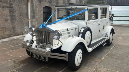White Imperial Viscount Landaulette 7-passenger wedding car with Blue Ribbons photographed in Portsmouth