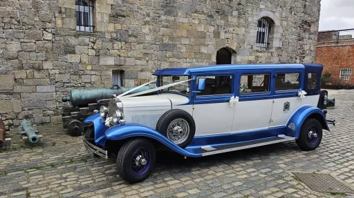 Left side view of the blue and white Bramwith Landaulette wedding car in Portsmouth