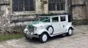 Left side view of the white Imperial Viscount Landaulette wedding limousine in Waterlooville