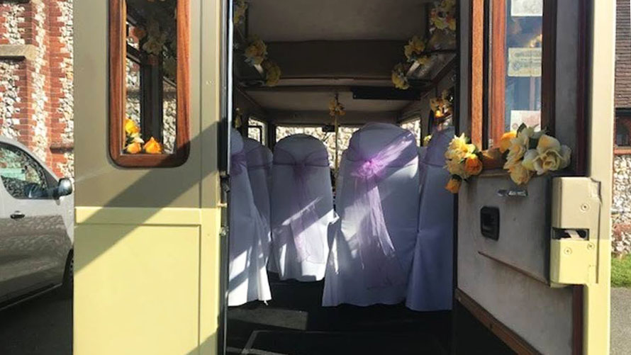 Rear passenger entrance of the cream and gold Asquith Mascot wedding bus