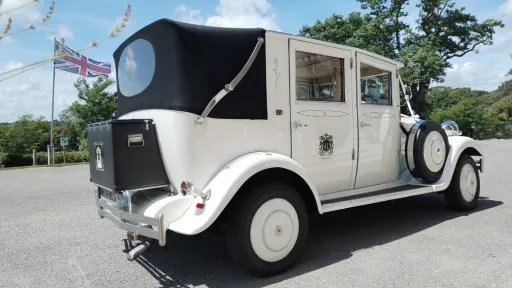 Rear view of the white Imperial Viscount Landaulette with its black rear roof closed