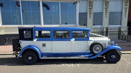 Right side view of the blue and white Bramwith Landaulette vintage-style wedding limousine
