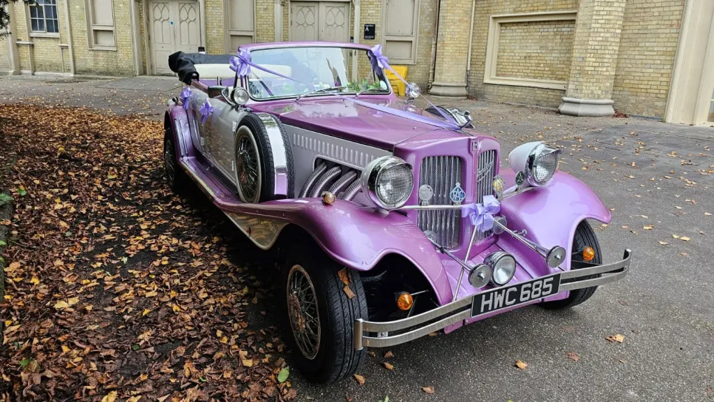 Front view of the lilac and white vintage-style Beauford Convertible wedding car with chrome detailing