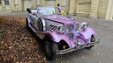 Front view of the lilac and white vintage-style Beauford Convertible wedding car with chrome detailing