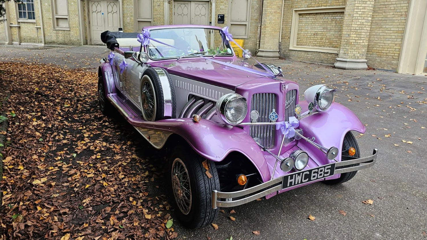 Front view of the lilac and white vintage-style Beauford Convertible wedding car with chrome detailing