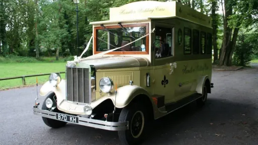 Front view of the cream and gold Asquith Mascot 8-seater vintage wedding bus