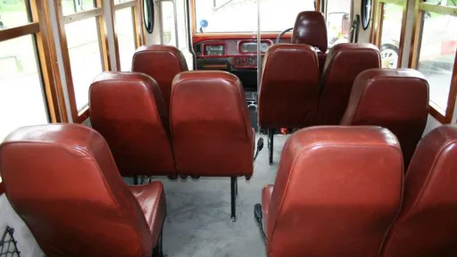 Brown leather seating layout inside the 8-passenger Asquith Mascot vintage wedding bus