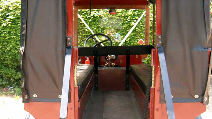 Rear passenger entrance of 1914 Ford Model T Charabanc with steps and curtains