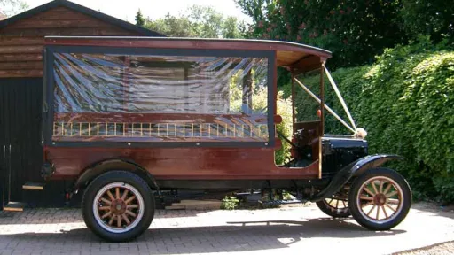 Side view of vintage 1914 Ford Model T Charabanc with enclosed passenger cabin with clip on side windows