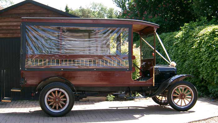 Side view of vintage 1914 Ford Model T Charabanc with enclosed passenger cabin with clip on side windows