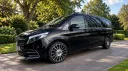 Left side view of black Mercedes V-Class Landjets luxury wedding vehicle