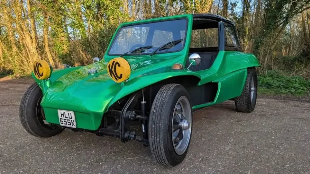 Green 1971 Volkswagen beach buggy wedding vehicle with wide tyres and yellow spotlights