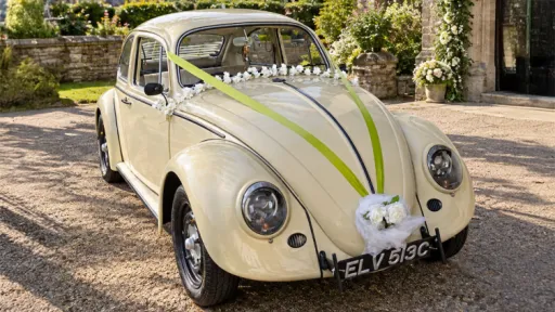 classic Volkswagen Beetle in Beige colour with wedding decoration