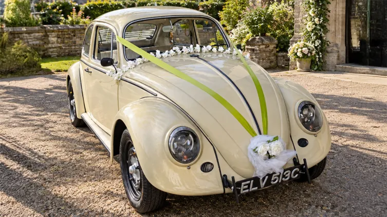 classic Volkswagen Beetle in Beige colour with wedding decoration