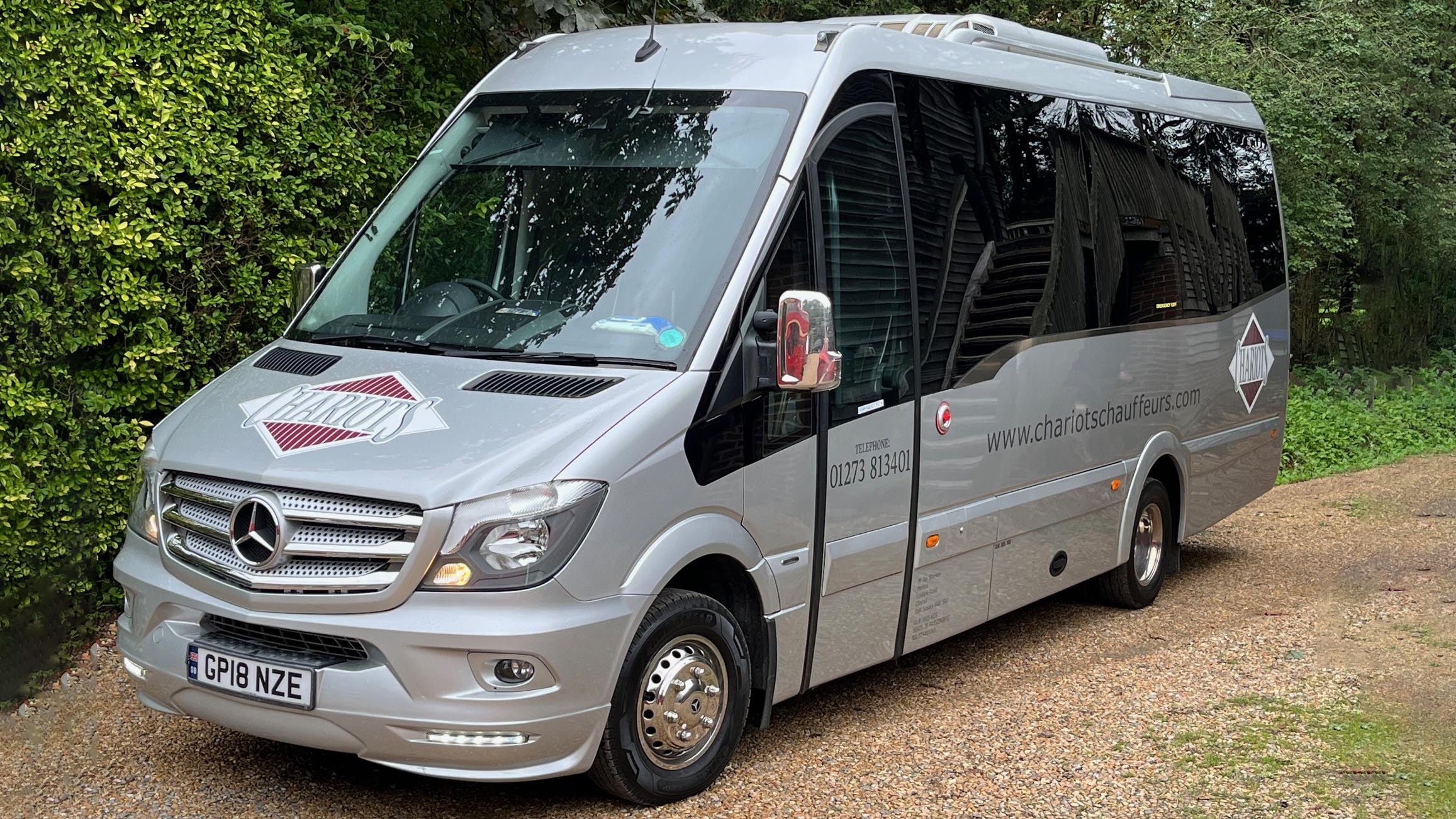 Silver Mercedes Bus with privacy windows