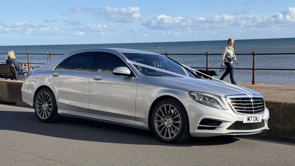 Silver Mercedes S-Class 350 LWB parked beside the seafront