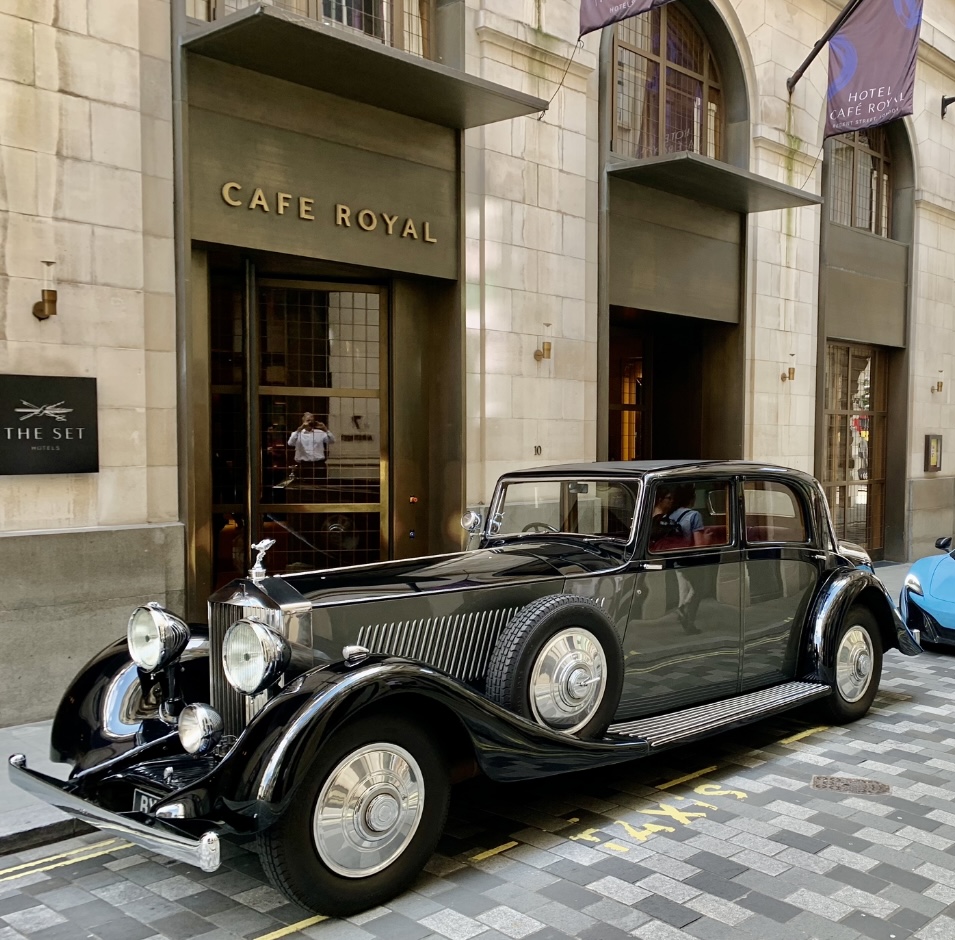 Vintage Roplls-Royce in Black & Grey parked outside wedding venue in street of London