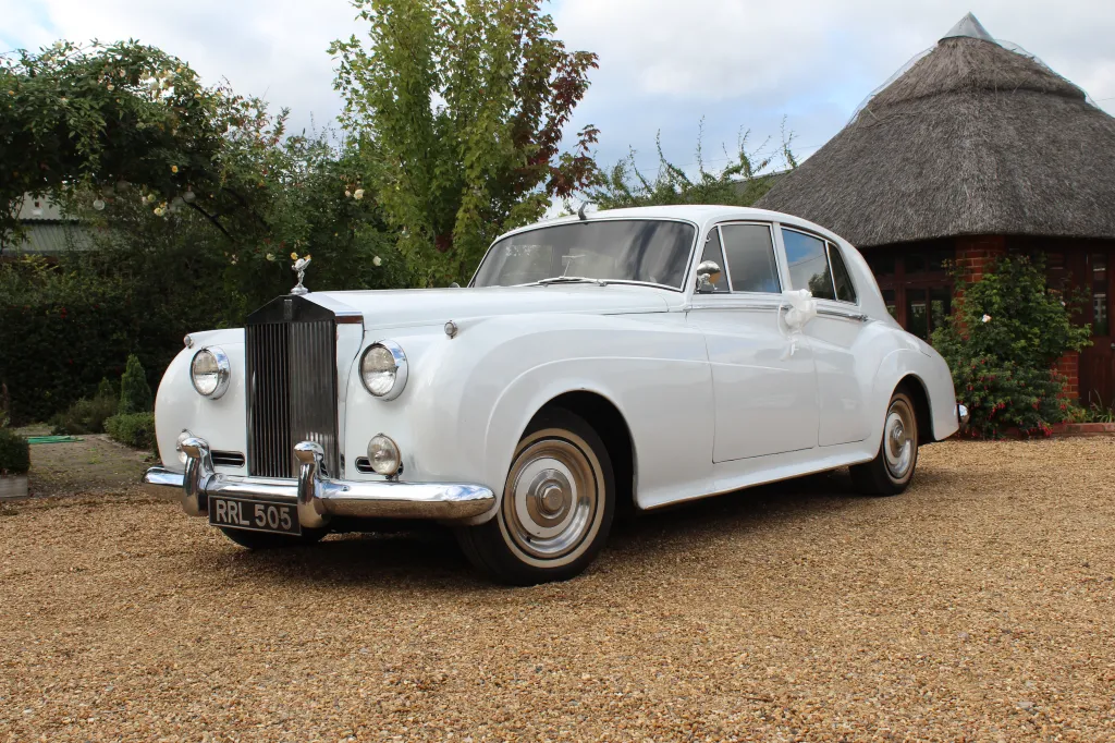 Classic white Rolls-Royce Silver Cloud in the garden of a popular wedding venue in Birmingham