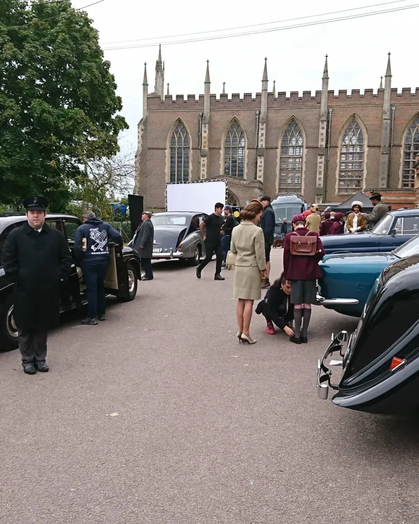 set of Cruella the Movie with the Rolls-Royce seen in the background