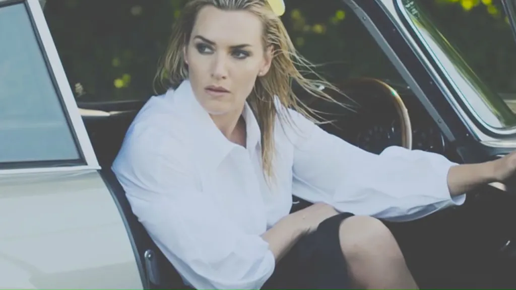 Kate Winslet stepping out of Classic Aston Martin DB5 from the Driver's side