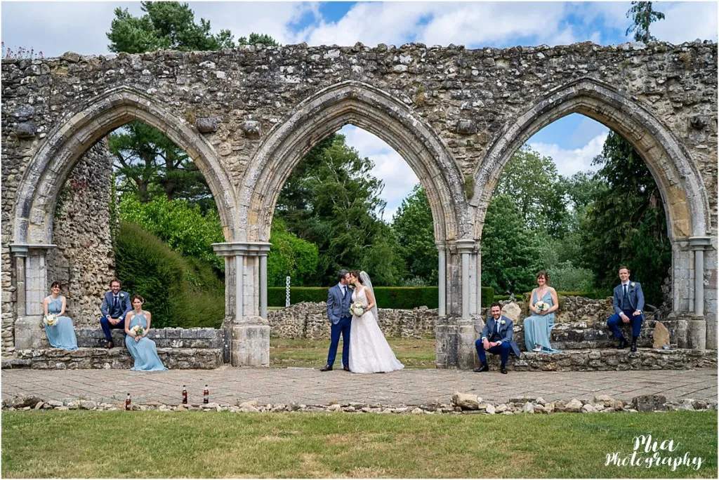 Newly married couple with their bridesmaids and groomsmen posing for photos at Domus