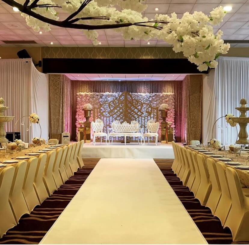 Wedding Breakfast room at the Hilton Doubletree with ivory table cloth and matching chair covers. 
