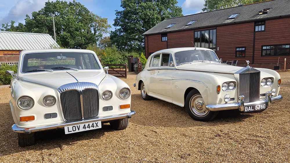 white Vintage Rolls-Royce with blacked out windows