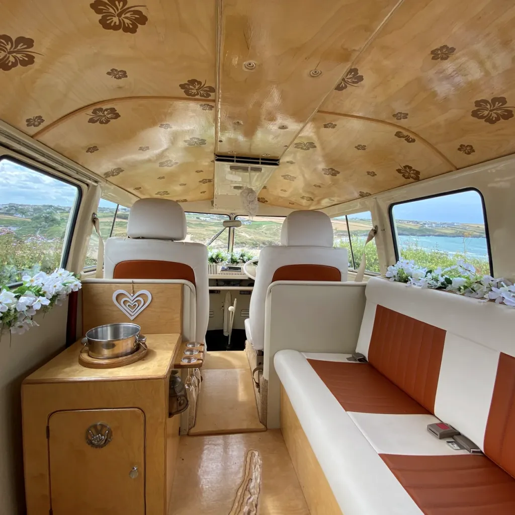 Classic VW Campervan interior with classic features and bench seats in White and Bronze colour