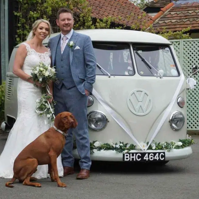 Classic VW Campervan with wedding couple and their dog