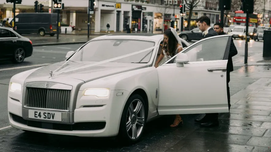 Modern White Rolls-Royce Ghost parked outside the Old Marylebone Town Hall