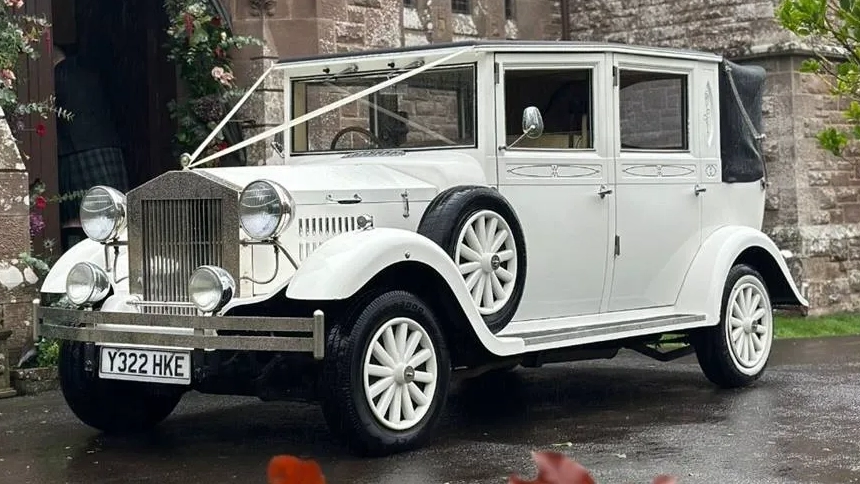 Modern White Rolls-Royce Ghost parked outside the Old Marylebone Town Hall