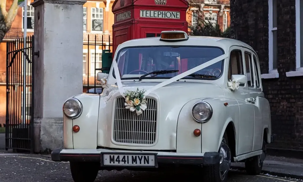 Flower bouquet fitted to the front chrome grille of a wedding car