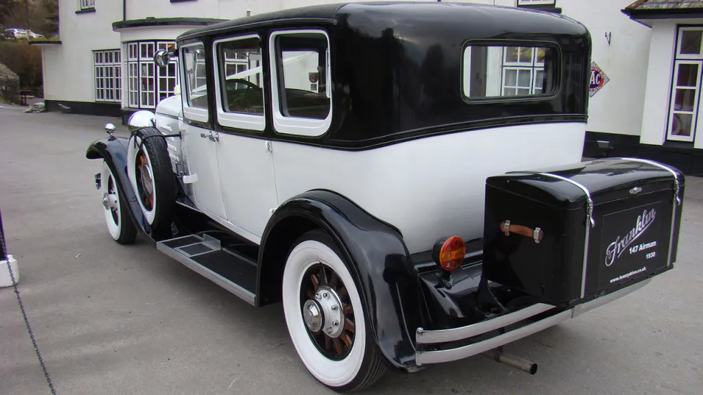 Rear view of vintage Franklin with black picnic trunk