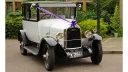 Citroen Deluxe Saloon in white with purple ribbons