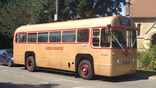 Vintage Single Decker bus parked in frotn of wedding church