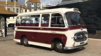 Right side view of a classic single decker Bedford bus parked in town