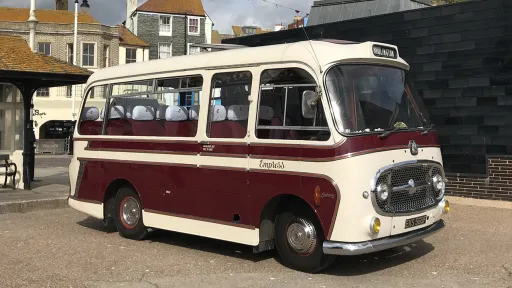 Right side view of a classic single decker Bedford bus parked in town
