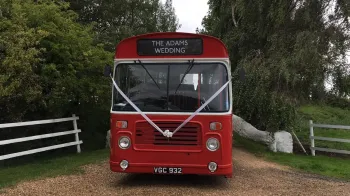 Full front view of a classic red single decker bus