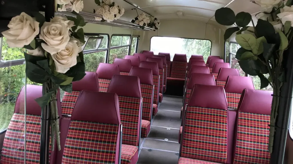 Classic single decker bus interior decorated with wedding flowers inside