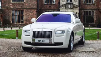 Rolls-Royce Ghost front view with chrome bumper.