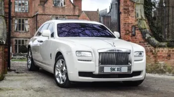 Rolls-Royce Ghost parked in front of wedding venues gate in Birmingham